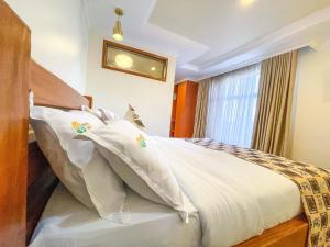 Postel nebo postele na pokoji v ubytování Pori City Hotel