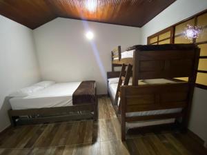 Postel nebo postele na pokoji v ubytování Casa turistica JB