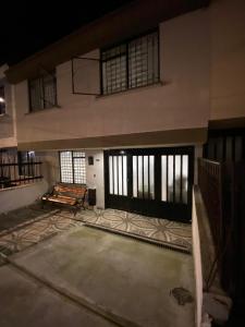 an empty room with a large building with windows at Espectacular casa en Manizales in Manizales