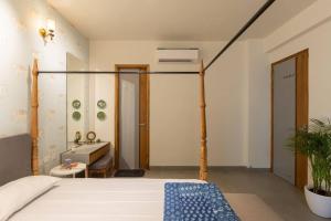 a bedroom with a bed and a sink at Saur Homestay in Jaipur