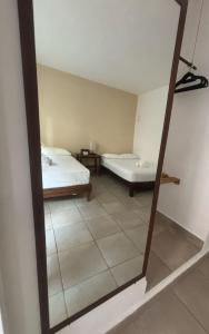 Postel nebo postele na pokoji v ubytování La Diosa Kali Beach Front Hotel