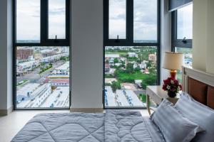 Postel nebo postele na pokoji v ubytování Sophia Apartment - Sophia Center Phu Cuong