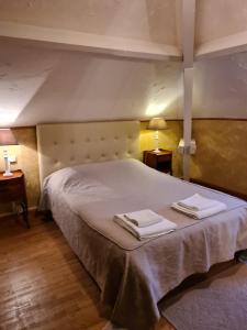 a bedroom with a large bed with towels on it at chez gallon chambres d’hôtes in Vézac +42 photos