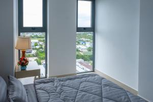 Postel nebo postele na pokoji v ubytování Sophia Apartment - Sophia Center Phu Cuong