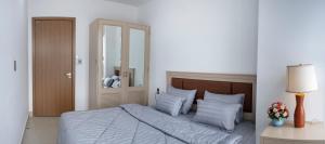 Postel nebo postele na pokoji v ubytování Sophia Apartment - Sophia Center Phu Cuong