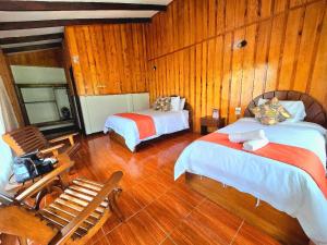Postel nebo postele na pokoji v ubytování Hotel de Montaña Suria