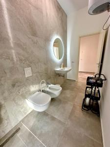 a bathroom with a sink and a mirror at Queens Luxury Vila 111B in Vlorë +21 photos