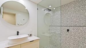a bathroom with a sink and a mirror at Alpine Heights 9 in Mount Hotham +7 photos