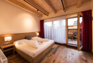 Voodi või voodid majutusasutuse Appartements Hubenhof toas