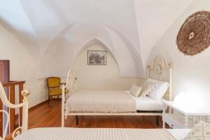 Postel nebo postele na pokoji v ubytování Casetta Rubichi Apartment