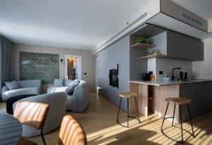 a living room with a bed and a kitchen at Panoramic Sea View Luxury Suite in Netanya