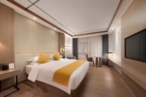 Poltton International Hotel - Chaozhou Hanjiang客房内的一张或多张床位
