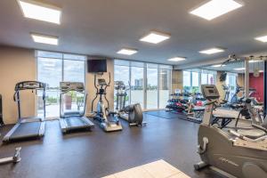 a gym with treadmills and elliptical machines at Golden Bay 1003 in Miami Beach