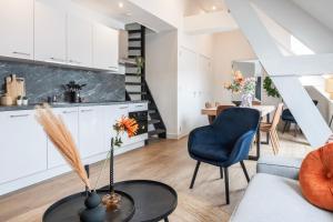 a living room with a couch and a table at XL home 2BR near university and supermarket in Tilburg