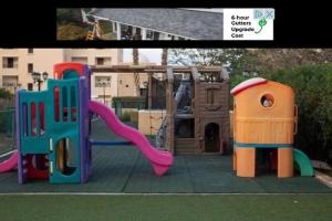 a playground with a slide and a play structure at Apartment at Samarah Resort DeadSea C13-Families & couples only in Sowayma