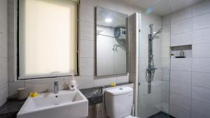 a bathroom with a toilet and a sink and a shower at Luxury Marshanda villa in Jimbaran +20 photos