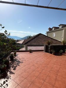 a backyard with a brick patio at Terrazza House Old Town Herceg Novi in Herceg-Novi