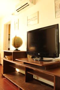 a large flat screen tv sitting on top of a table at Terrazza House Old Town Herceg Novi in Herceg-Novi
