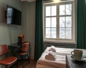 a hotel room with a bed and a window at Trolltunga Hotel in Odda