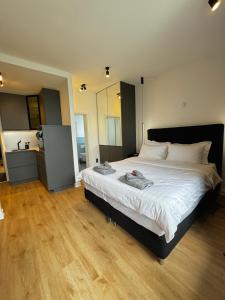 Ένα ή περισσότερα κρεβάτια σε δωμάτιο στο Garden Apartments