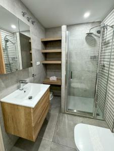 a bathroom with a sink and a shower at Seaview apartment Peñoncillo in Torrox Costa