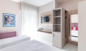 Postel nebo postele na pokoji v ubytování Hotel Biancamano