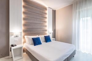 Postel nebo postele na pokoji v ubytování Hotel Biancamano