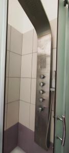 a shower in a bathroom with a glass door at House with view in Levkopiyí +24 photos