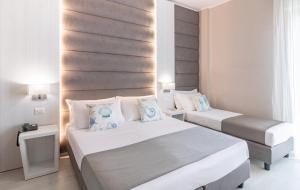 Postel nebo postele na pokoji v ubytování Hotel Biancamano