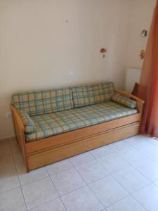 a couch in the corner of a room at παραθαλασσιο σπιτι στην εξοχη in Tsakaíoi +36 photos