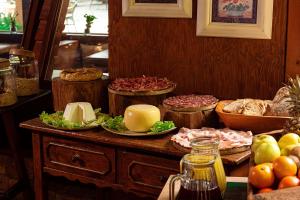 a table with many different types of food on it at Agriturismo La Cerra in Tivoli