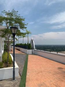 a street light sitting on the side of a building at Little Deer Homestay in Kota Bharu