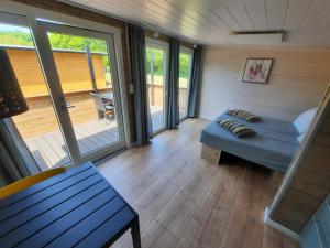Postel nebo postele na pokoji v ubytování Guldborg Camping & Cottages - small luxury