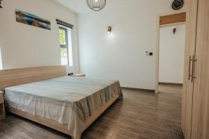 Letto o letti in una camera di Two Villas