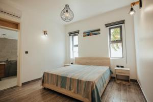 Letto o letti in una camera di Two Villas