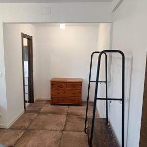 a room with a dresser and a ladder in it at Duquesa Harbour Club Aparthotel in Manilva