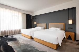 Fotografie z fotogalerie ubytování Yue Xin Yuan Spa Resort v destinaci Mile