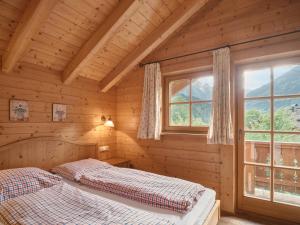 Postel nebo postele na pokoji v ubytování Chalets Huber