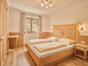 Postel nebo postele na pokoji v ubytování Chalets Huber