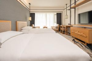 Fotografie z fotogalerie ubytování Yue Xin Yuan Spa Resort v destinaci Mile