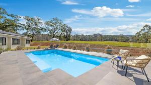 an image of a swimming pool in a yard at Koala Lane - Family, Pool, Sleeps 10, Luxe in Bonville