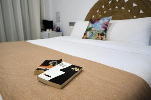 Postel nebo postele na pokoji v ubytování Hostal Aires del Mar