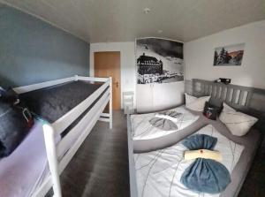 a bedroom with two bunk beds in a room at Apartment Fudel in Kurort Oberwiesenthal