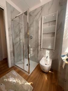 a bathroom with a shower and a toilet and a sink at Affittacamere Via Prione in La Spezia