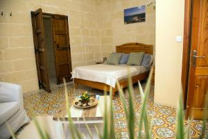 Voodi või voodid majutusasutuse A la maison B&B toas