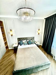 En eller flere senge i et værelse på ЖК METROPOLE Business