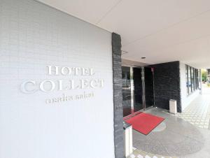 a hotel colbert sign on the side of a building at HOTEL COLLECT in Sakai