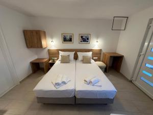 Postel nebo postele na pokoji v ubytování A-Rooms Serviced Accommodation in Mostar
