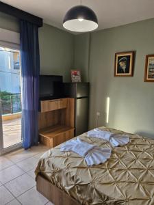 Postel nebo postele na pokoji v ubytování Julie Apartment
