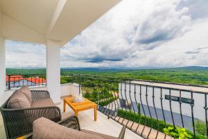 a balcony with a view of the water at PERLA VERDE Apartments in Krk